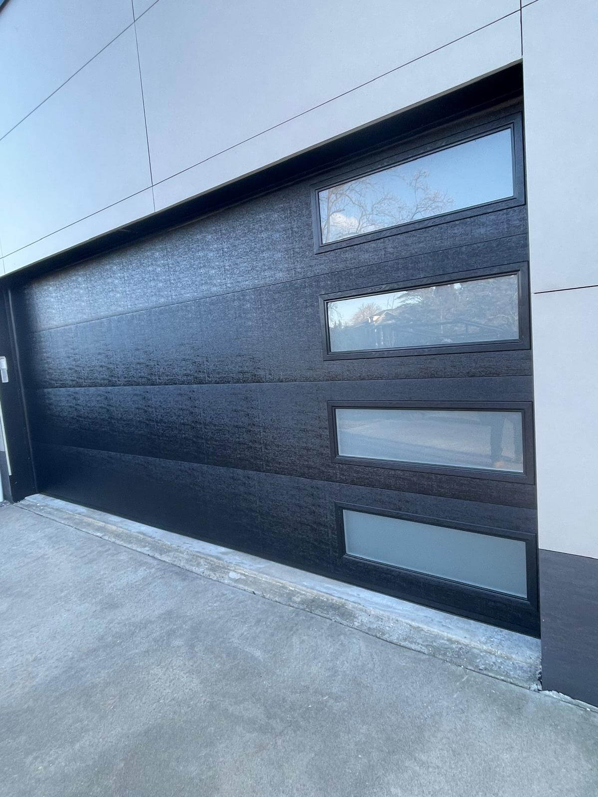 Modern full-view glass garage door installation in Manhattan, NYC