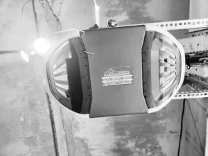 Garage door opener motor unit showing Learn button for keypad programming