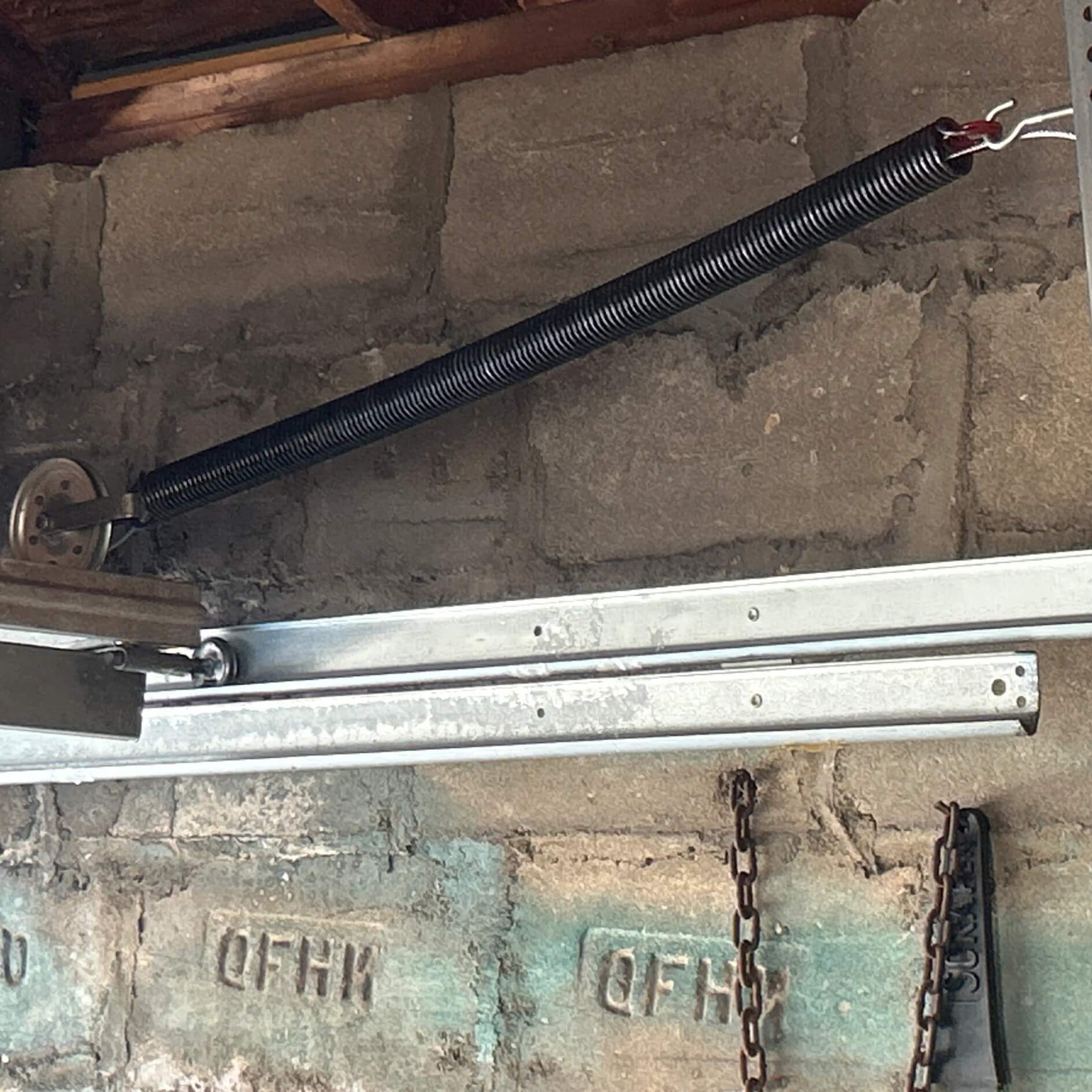 Garage door extension spring replacement performed in Queens, NY