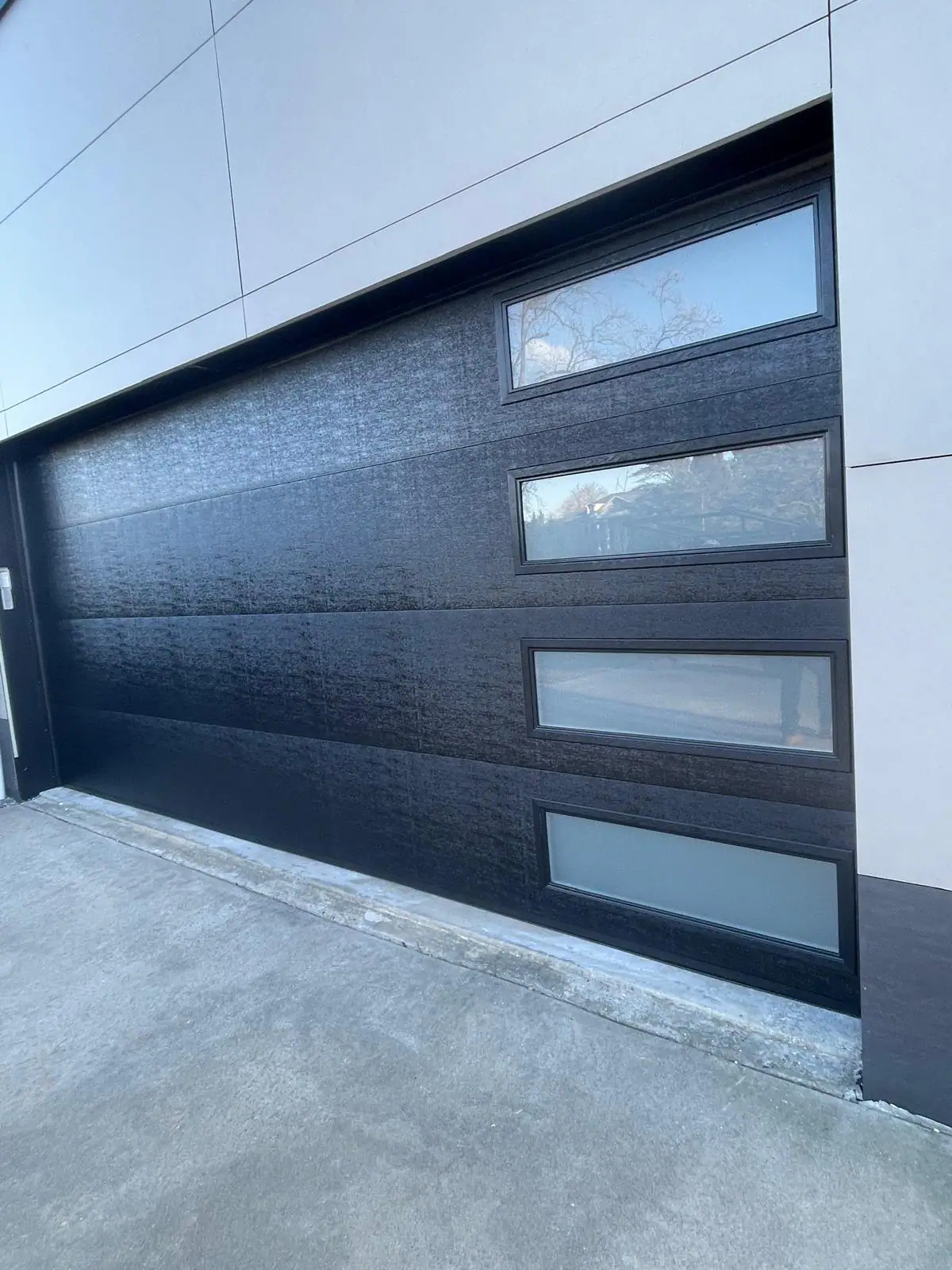 Modern full-view glass garage door installation in Manhattan, NYC