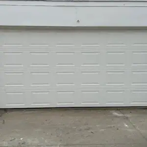 White sectional garage door replacement completed by H&O Garage Doors in Bronx, NY