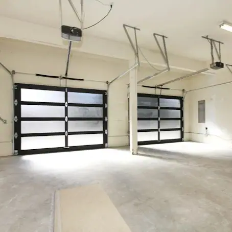 Interior view of double garage with newly installed overhead doors in Bronx, NY