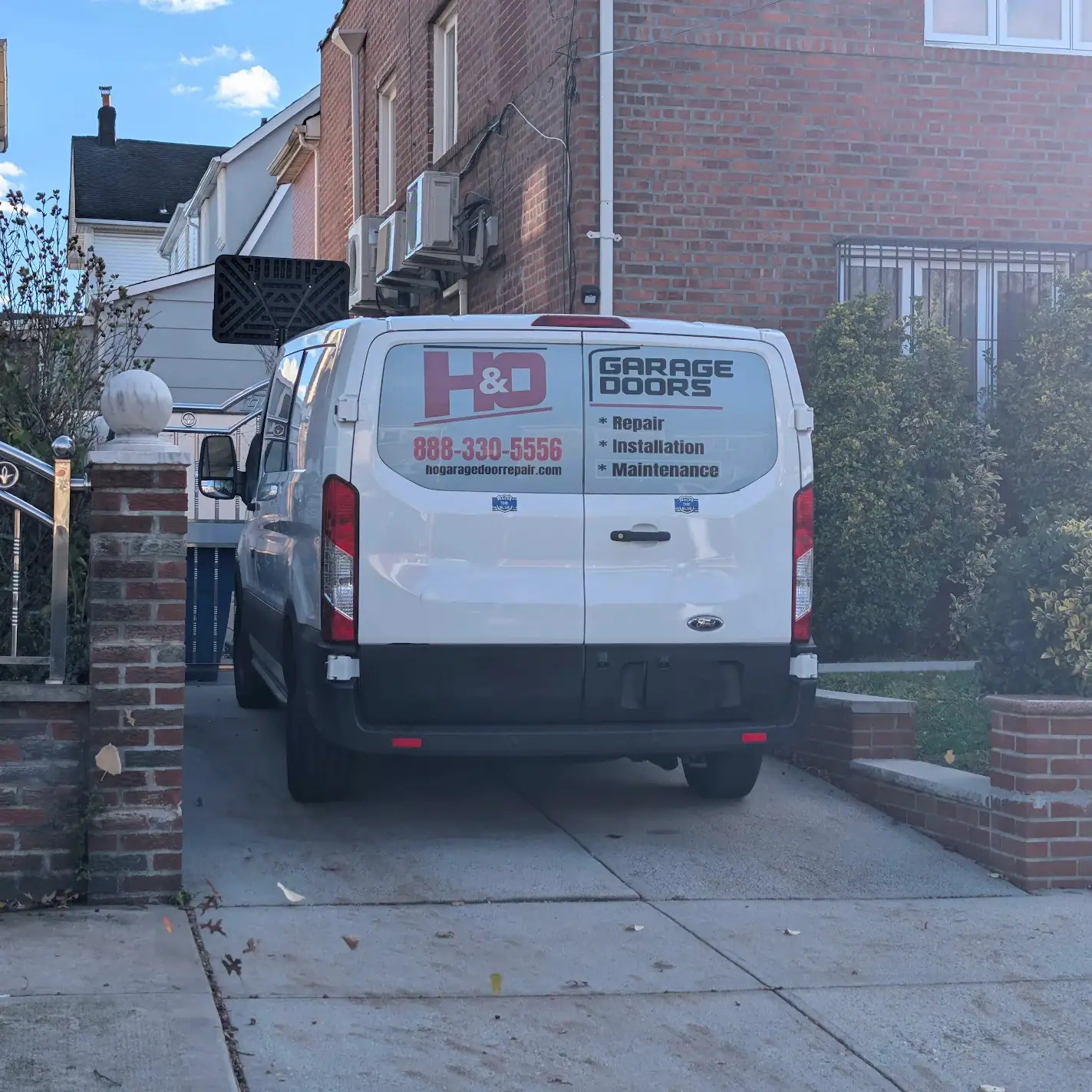 H&O Garage Doors service truck arriving for garage door repair in Queens, NY